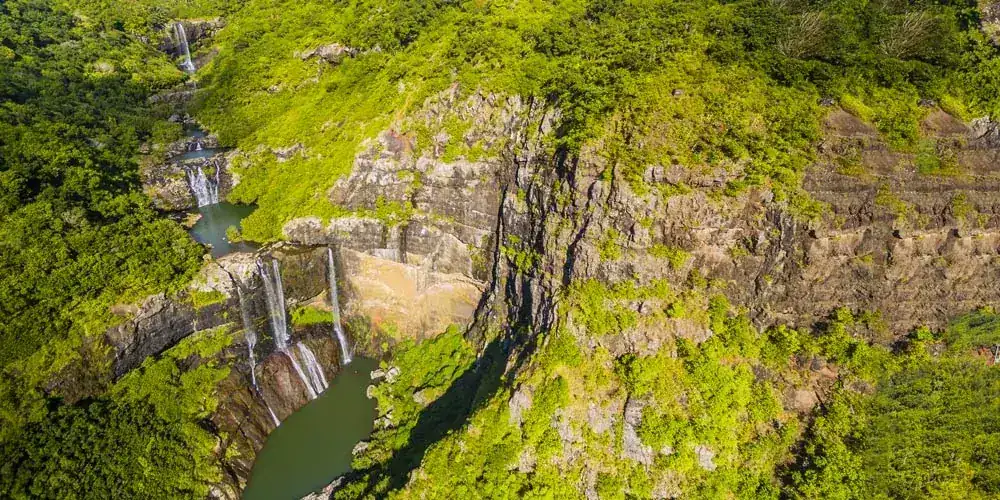Aerial view of Tamarind Falls and green cliffs