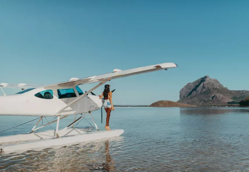 Seaplane beside the shore with Le Morne in the background