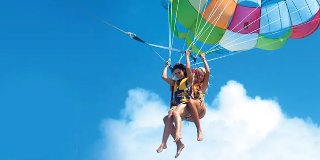 Tandem parasailing with a colorful parachute